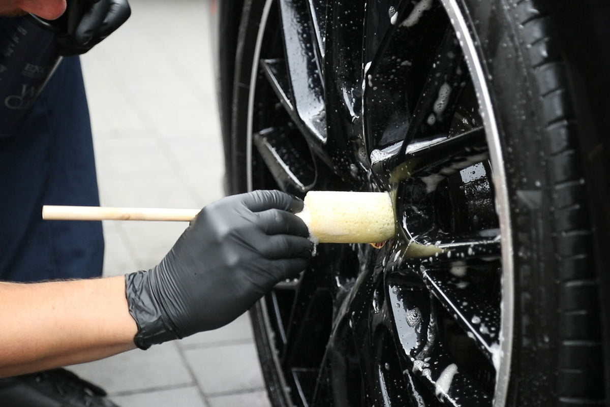 Cleaning alloy wheel spokes with the Sponge Guru round wheel detailer
